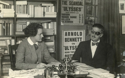 James Joyce with his publisher Sylvia Beach in her bookstore, Shakespeare and Company, in Paris, 1922.